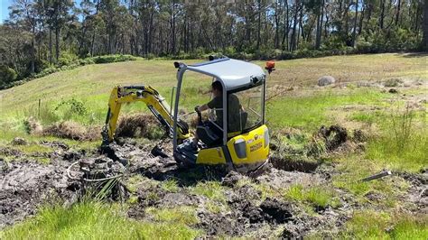 mini excavator stuck in mud